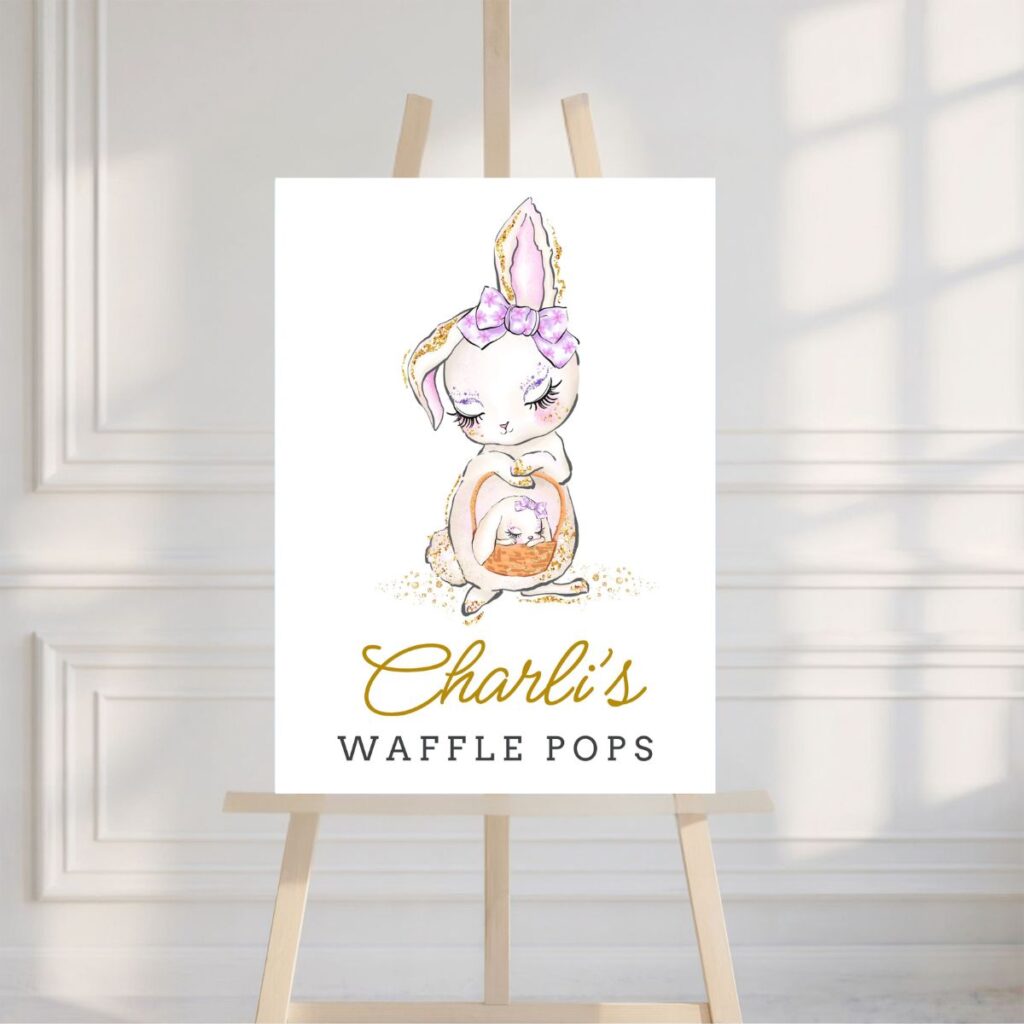 Easter Waffle Pops party sign displayed on an easel in front of a white wall — a printable from Inspired Party Design to help readers style their own party setup.