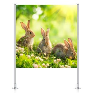 Easter backdrop featuring three bunnies in a spring meadow, displayed on a silver backdrop stand, showcasing Inspired Party Backdrops.