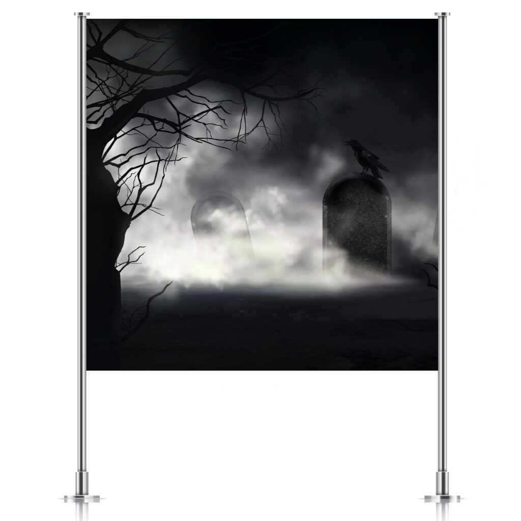 Spooky graveyard backdrop displayed on a stand, ideal for witch-themed kids’ parties, available from Inspired Party Backdrops.