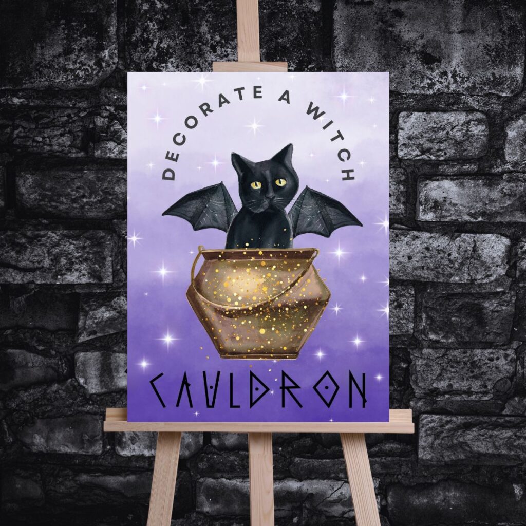 DIY cauldron party sign on easel in front of black brick wall, promoting Inspired Party Design shop.