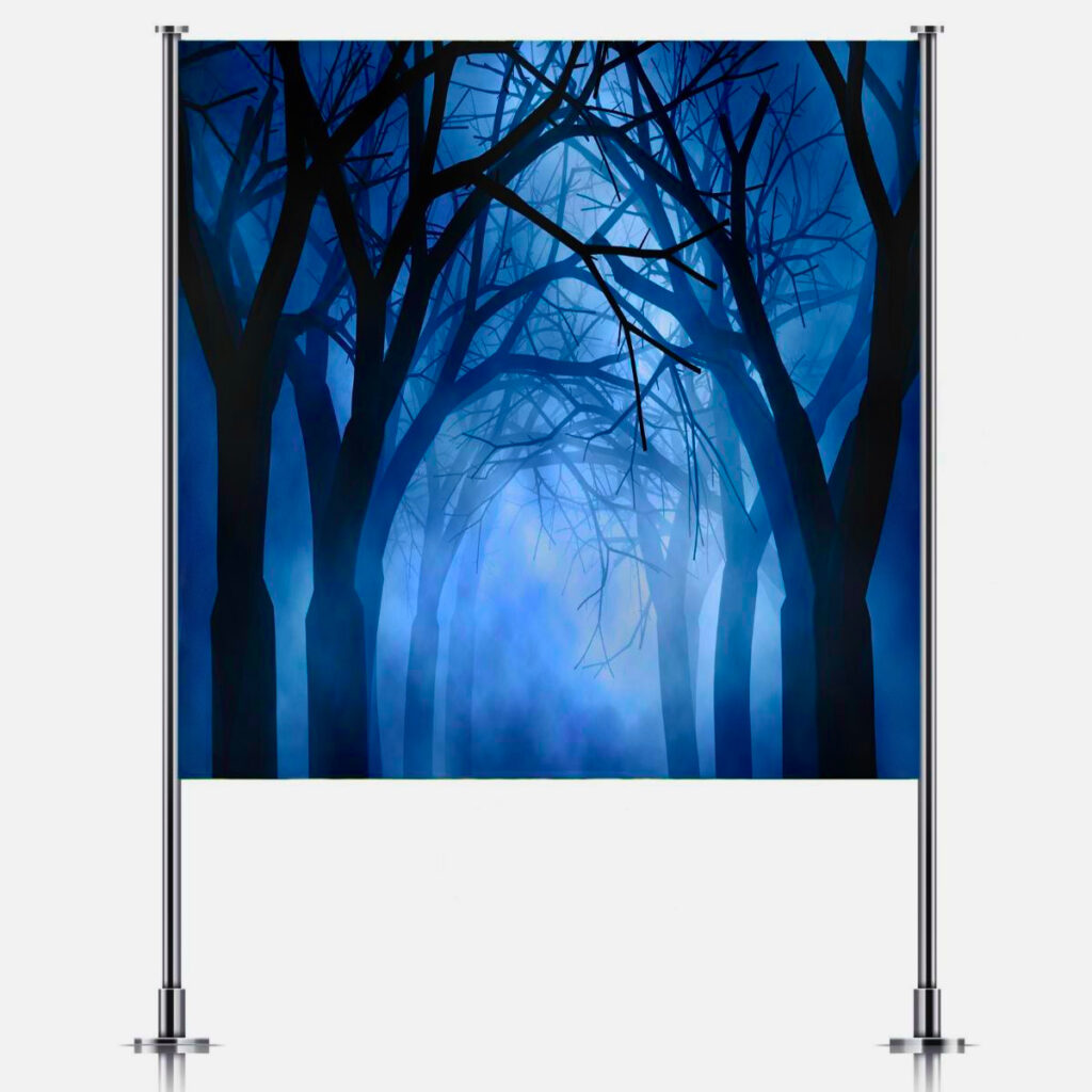 Spooky forest backdrop on stand from Inspired Party Backdrops, perfect for DIY cauldron party setup.