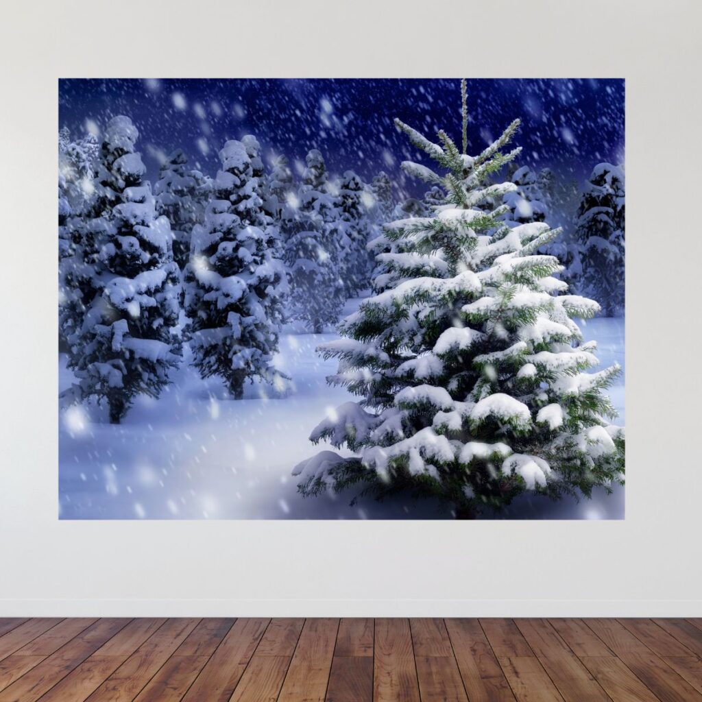 Snowy Christmas tree party backdrop displayed on a wall, promoting Inspired Party Backdrops shop.