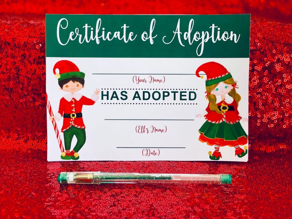 Close-up of an elf adoption certificate with a pen in front, ready for signing at an elf adoption party.