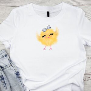 White t-shirt with Easter chick design promoting Inspired Party Merch shop.