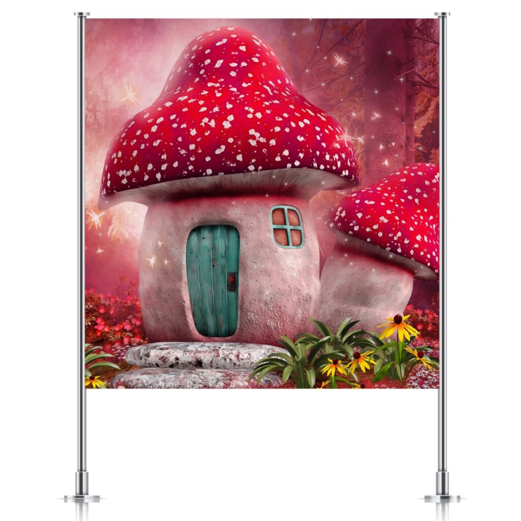 Red fairy mushroom house backdrop displayed on stand for kids fairy party, promoting Inspired Party Backdrops.