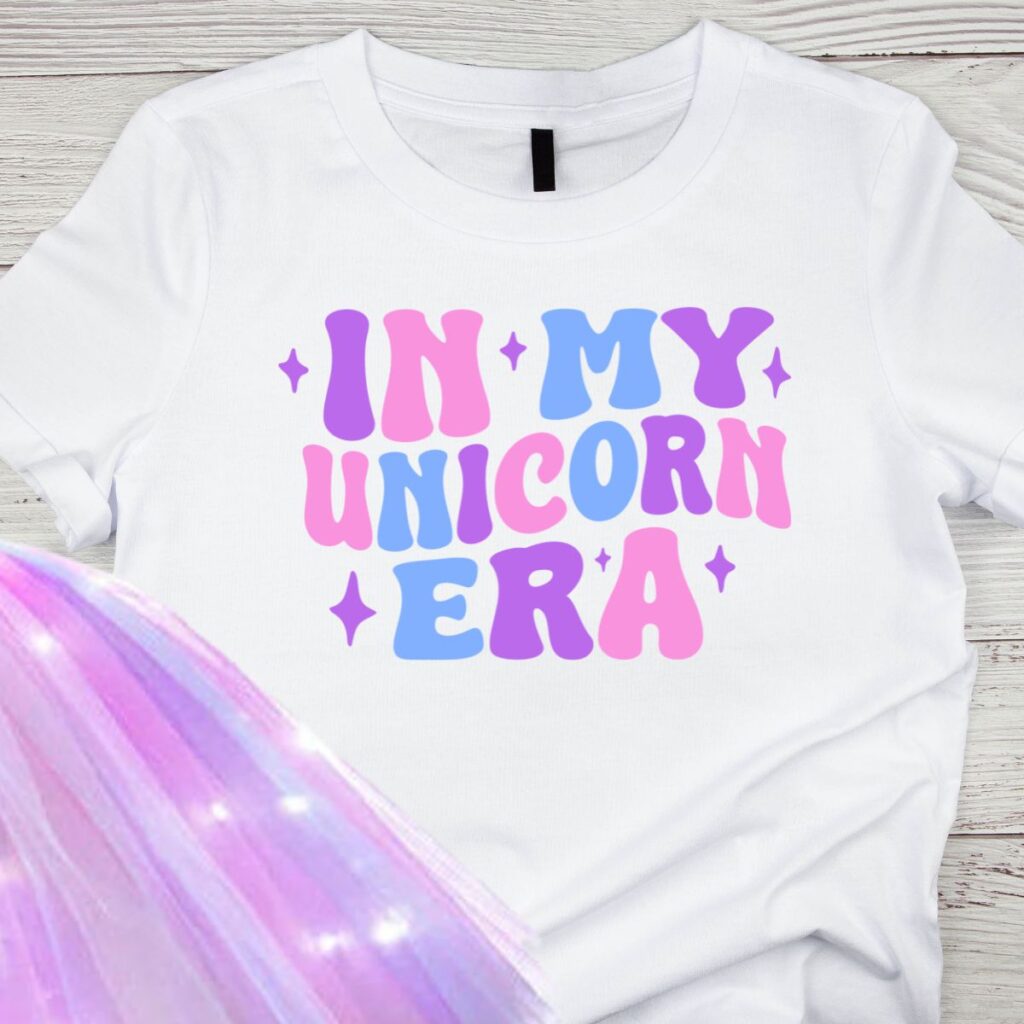 Kids “In My Unicorn Era” pastel t-shirt with unicorn design from Inspired Party Merch for unicorn party fun.