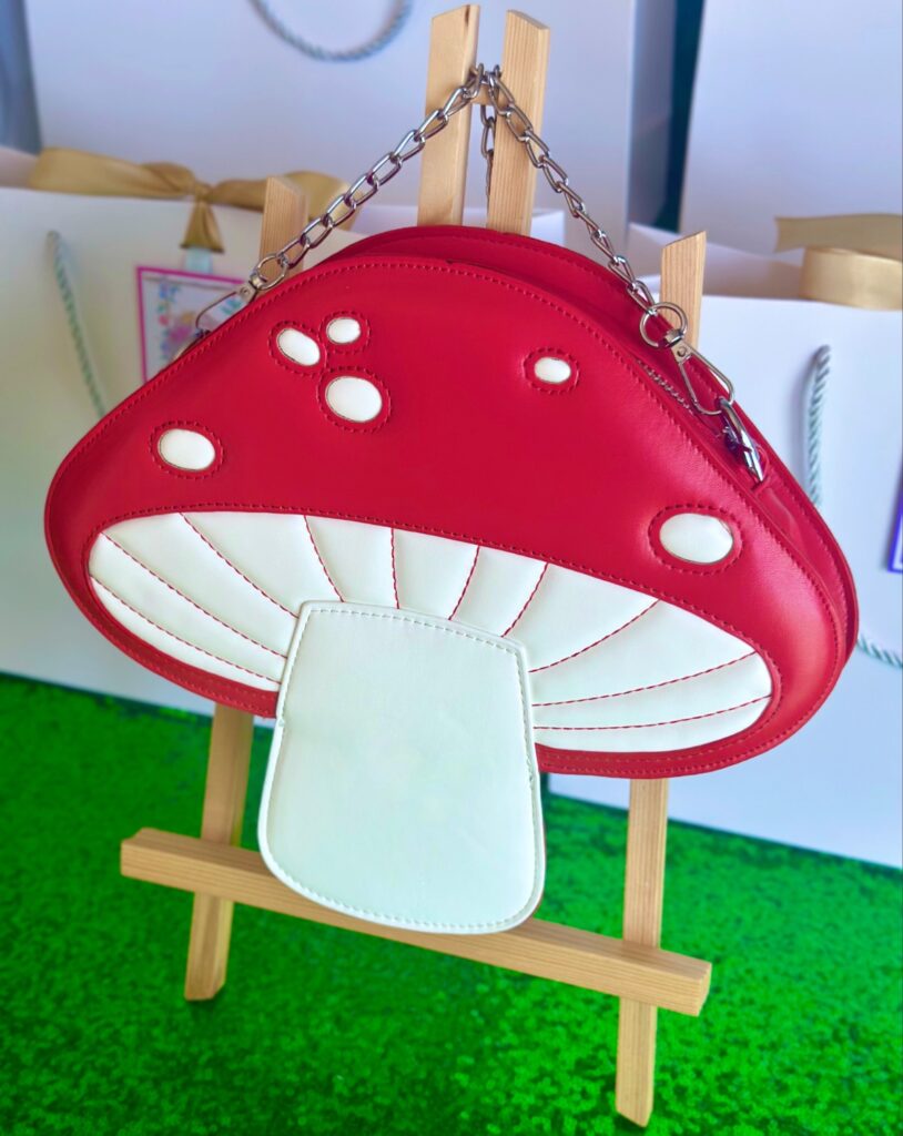 Red and white toadstool handbag kids party favour, a mushroom-shaped children’s bag with handle, perfect as a party gift or themed favour idea.
