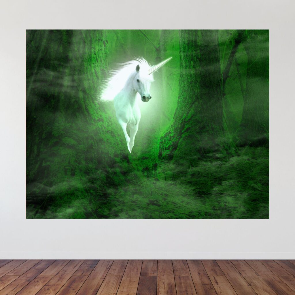Unicorn party backdrop on wall with green forest and white unicorn design, promoting Inspired Party Backdrops.