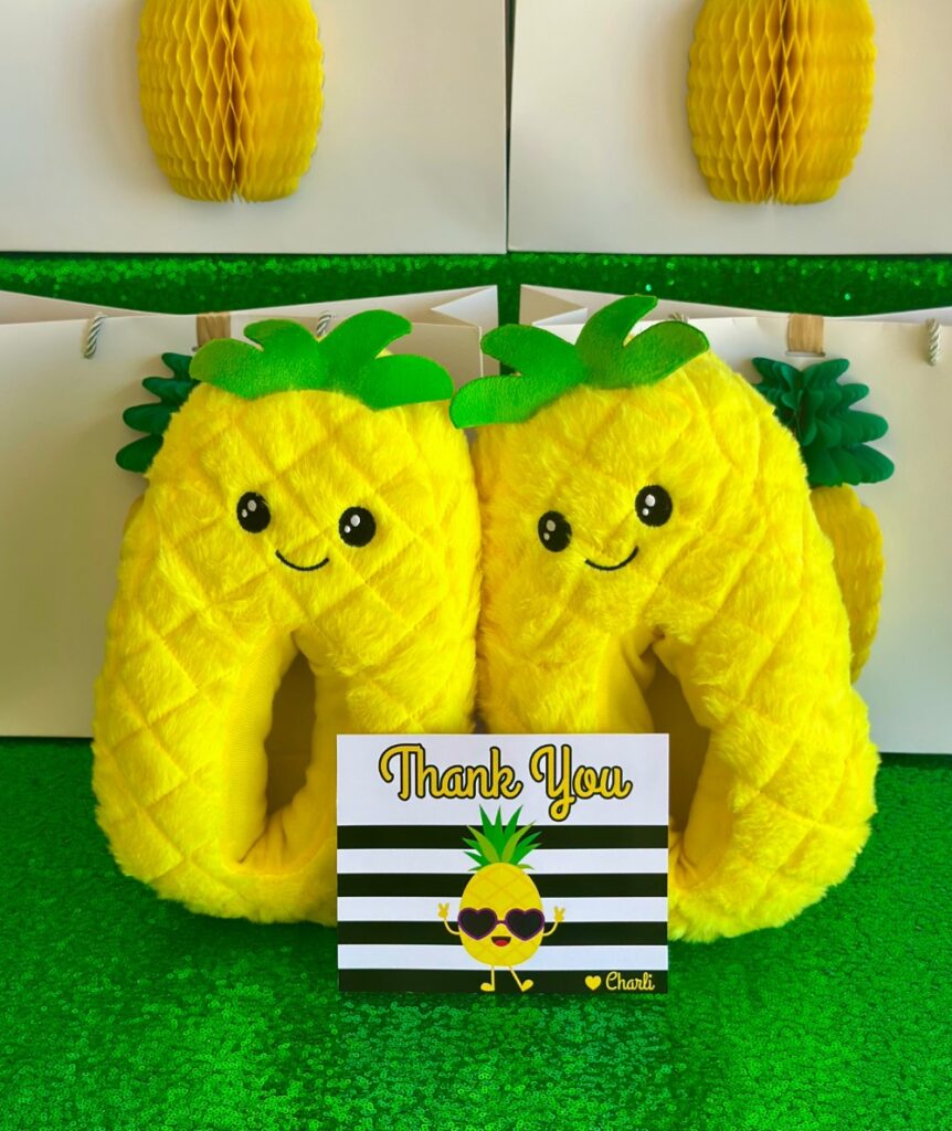 Kids pineapple party favour featuring kawaii pineapple slippers with a personalised thank you card.