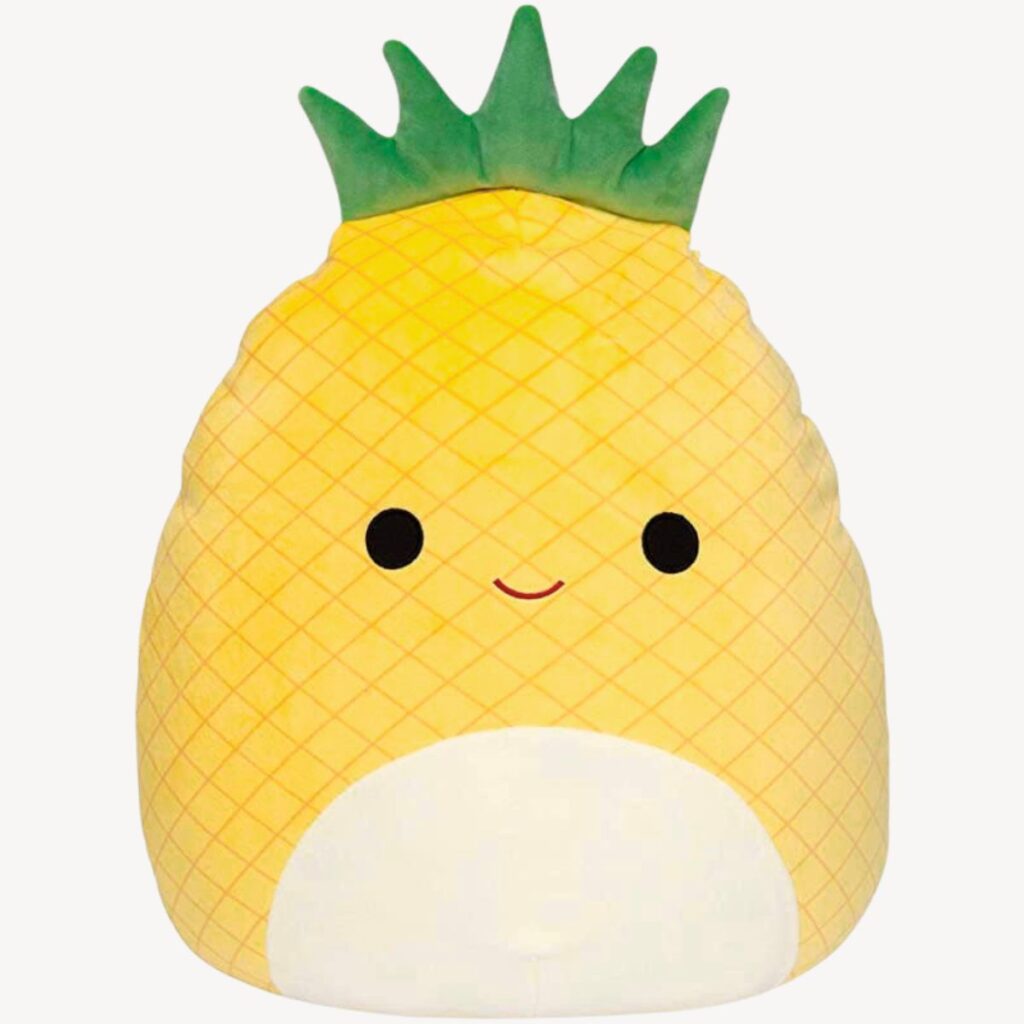 Cute kawaii pineapple pillow used for a kids pineapple party game.